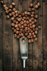 Nuts on an old wooden background. The view from the top. Art.