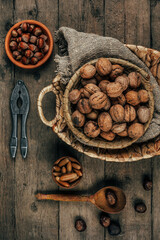 Nuts on an old wooden background. The view from the top. Art.