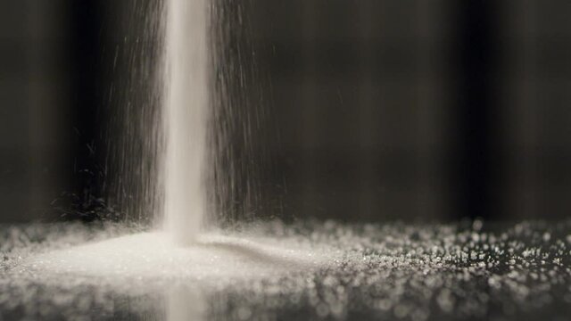 White sugar macro moves into the table 4k SLOW MOTION