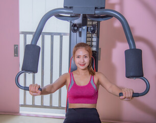 Young woman workout in gym healthy lifestyle.. Young women play sports in the gym to exercise