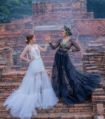 Thai Woman wearing Thai Traditional Dress in the old temple and pagoda of Thailand