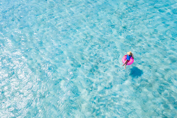 Top above high angle aerial drone view of her she slim fit girl floating on rubber ring in sea water pool poolside dream tour enjoying relax recreation sunny weather outdoor fresh air breeze