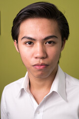 Face of young Filipino businessman looking at camera