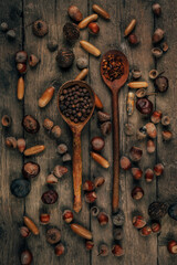 Nuts on an old wooden background