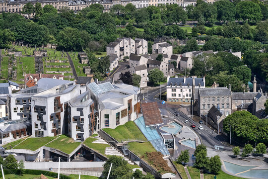 Aerial photo of the Parliament building in Edinburgh and the Canongate Kirkyard behind it