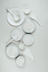 Still life with sea salt in a white dish. The view from the top. Art.
