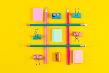 School pencils on yellow background with School supplies. Minimal concept art. Creative flat lay top view back to school concept with stationery.