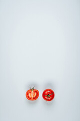 Still life with red tomatoes on a light background. The view from the top. Art.
