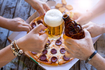 Fast food concept with pepperoni pizza with many hands
