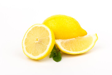 Group of lemons with mint leaves, isolated on white background