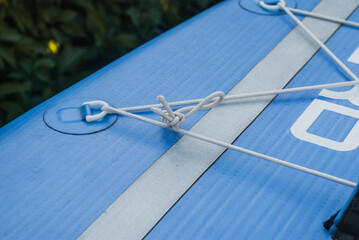 inflatable paddle Board close-up, elastic slings for Luggage,