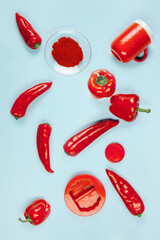 Red pepper on a blue background. The view from the top.