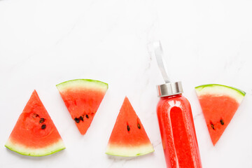 Fitness, healthy nutrition diet concept. Fresh cool watermelon juice in a glass jar and watermelon...
