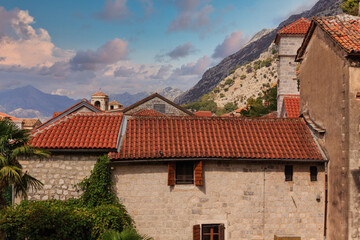 Fototapeta na wymiar Old Stone Buildings with Red Tile Roofs in Kotor, Montenegro