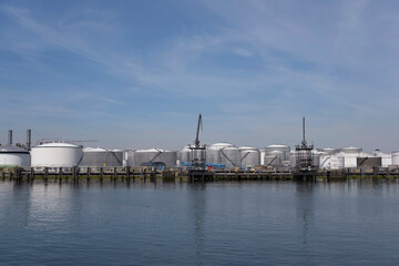 Refinery tower in petrochemical industrial plant with cloudy sky