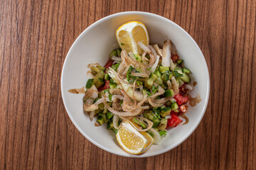 salad with lemon in bowl