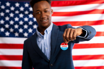 African man holding badge about the Presidential election