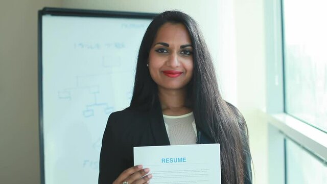Indian woman holding her resume