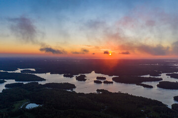 Fototapeta na wymiar Sunrise over the islands of the water world in Karelia. Aerial view.