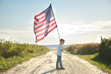 Child is holding American flag, back side