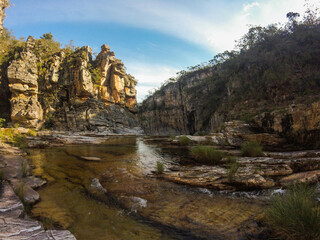 Large canyon with a small river running across the rocks at Serra da Canastra region in Brazil.