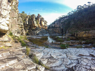 Large canyon with a small river running across the rocks at Serra da Canastra region in Brazil.
