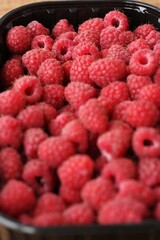 Delicious ripe raspberries on the market macro 