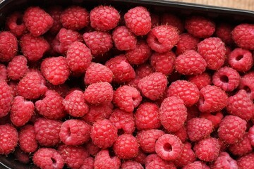 Delicious ripe raspberries on the market macro 