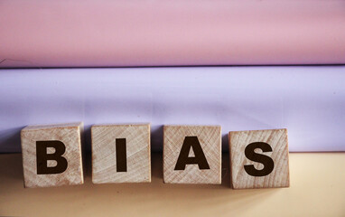 Bias word from wooden blocks, personal opinions prejudice bias concept