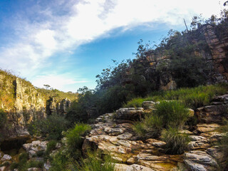 Large canyon with a small river running across the rocks at Serra da Canastra region in Brazil.