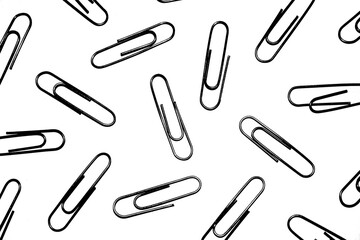 Many silver paper clips isolated on white studio background. Paper clip background / texture