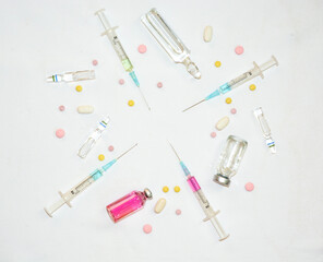 Medical background with vaccine, ampoules, 
syringes and tablets. Coronavirus Covid-19 pandemic concept