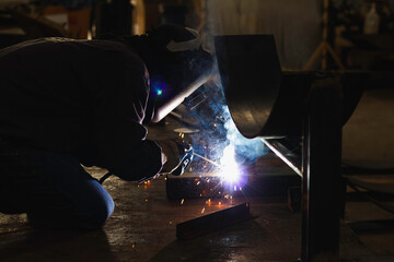 Metal workers use manual labor. Skilled welder. Factory workers making OT. Welder is welding the steel in the factory. welder Industrial automotive part in factory.