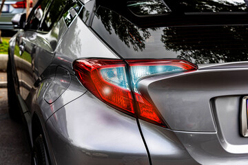 Car tail lights isolated from the background, electric power lighting technology