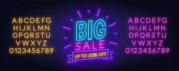 Big Sale neon sign on brick wall background. Neon alphabet on brick wall background. Template for a design.