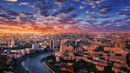 Moscow aerial sunset panorama with river and buildings under dramatic sky