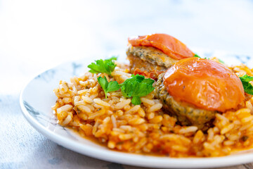 Stuffed tomatoes and rice with tomato