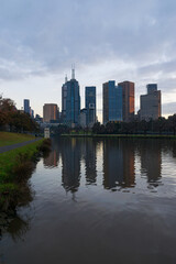 Fototapeta na wymiar Rippled reflection of the Melbourne CBD in the Yarra River.