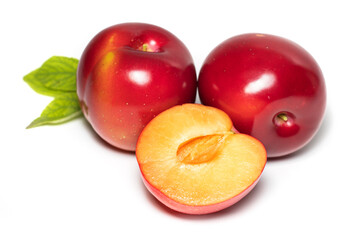 Plum fruit with plum leaf isolated on a white background