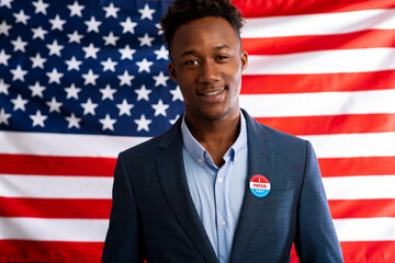 African american patriot man pinned vote button on suit