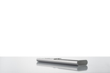 Modern metal remote control from tv on a white background
