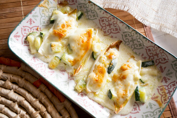 Gratin endives with zucchini and bechamel