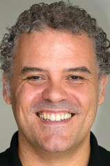 Obraz premium Face of happy mature Hispanic businessman smiling