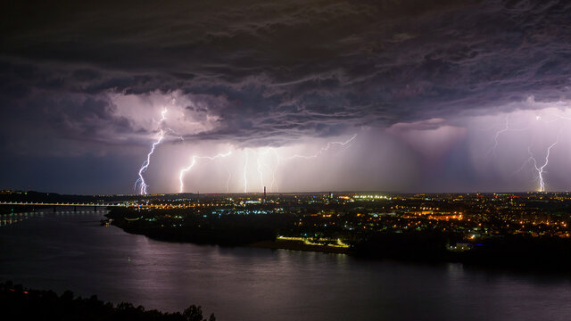 Rainstorm with lightnings over the big city.