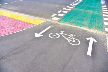 View of the paved bike path.  Road marking of sign of bike path. Sign of Cycling lane on road track in city street.