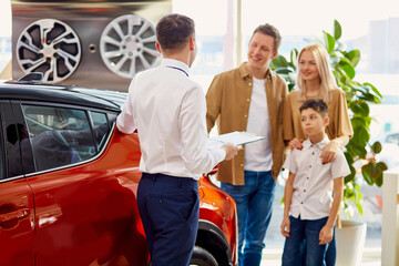 confident nice salesman have conversation with clients, talk about their dealership, cars and their characteristics
