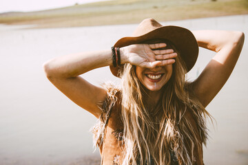 close up of a boho blonde girl outdoors in a sunny day © Dellealpi
