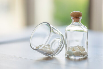 Close up medicine in abottle on wooden table. healthy and medical concept.