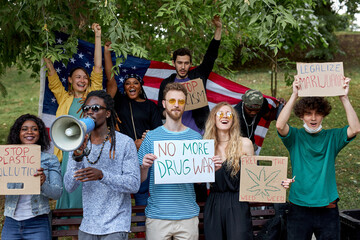 mix race diverse american people holding legalize cannabis now protest poster, medical marijuana...
