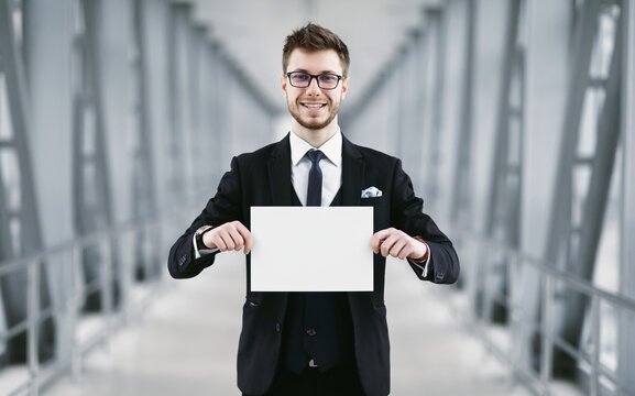 Man Holding Empty Signboard At International Airport